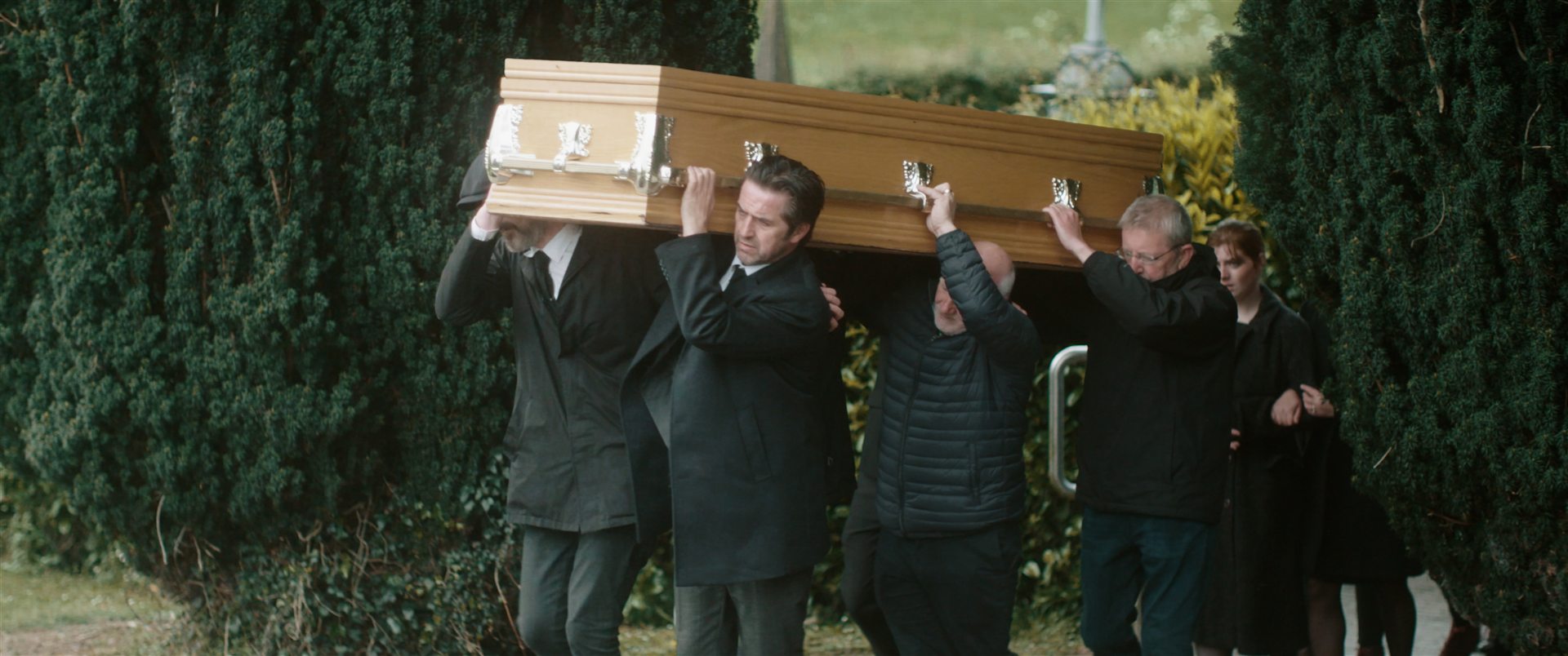 Funeral scene film still from Tuesday Traders